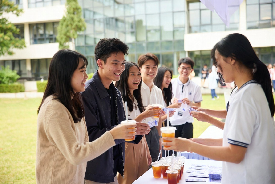 Students receiving free coupons and bubble tea at campus event