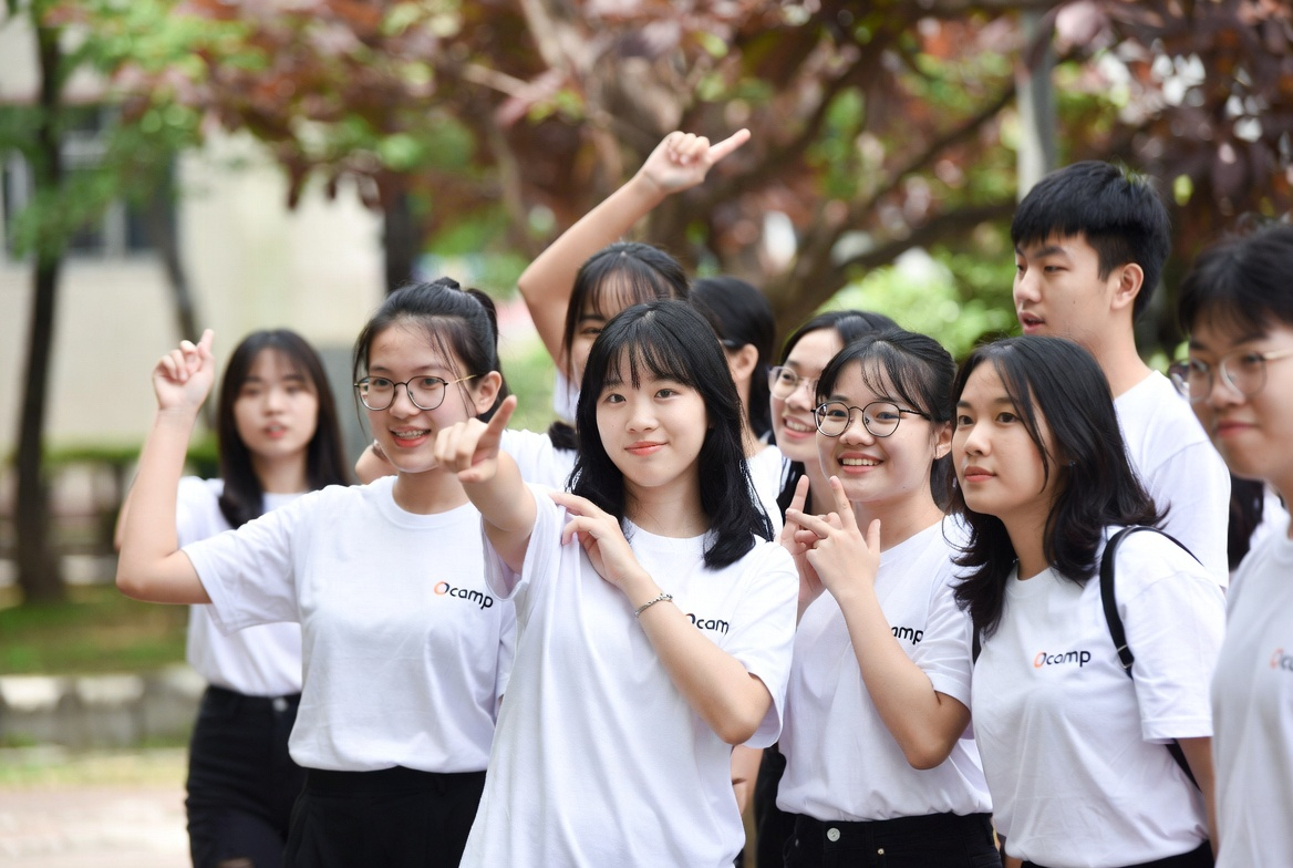 Student group in branded orientation camp t-shirts